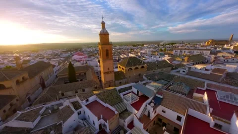 FPV Drone flying at sunset over the church tower in Osuna Video stock 259058209