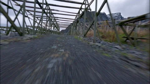 FPV Drone Flying Through Fish Racks in Norwegian Fishing Village 스톡 동영상 308729287