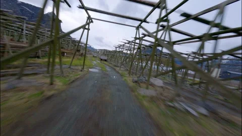 FPV Drone Flying Through Fish Racks in Norwegian Fishing Village 스톡 동영상 308729312