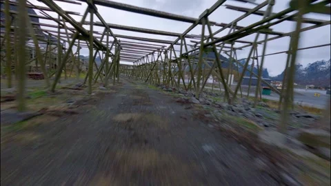 FPV Drone Flying Through Fish Racks in Norwegian Fishing Village 스톡 동영상 308729343