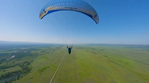 Fpv drone flying through a paraglider Stock Footage 246574625