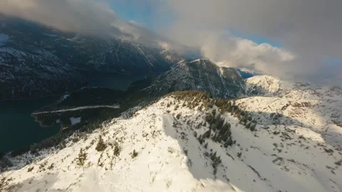 FPV Drone Flyover of Snow-Capped Mountain in the Alps Stock Footage 305801276