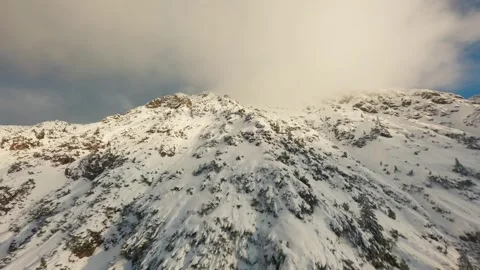 FPV Drone Flyover of Snow-Capped Mountain in the Alps Video stock 305801853
