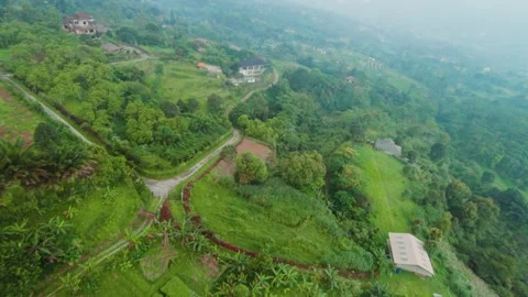 FPV drone flythrough over Asian mountain village Video stock 326589432