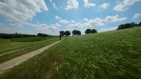 FPV drone following a cyclist Stock Footage 313829376
