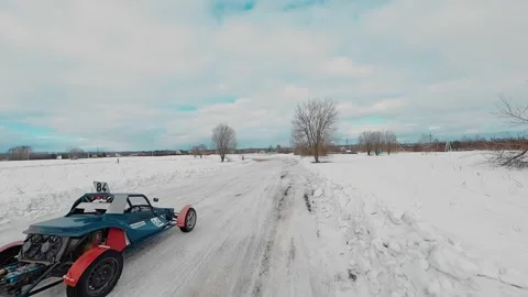 The FPV drone follows an off-road buggy rushing along the highway Stock Footage 194744237