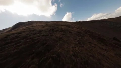 FPV Drone footage: Smooth Stabilized Fly along Mountain Rocky Hill around Stock Footage 162829246