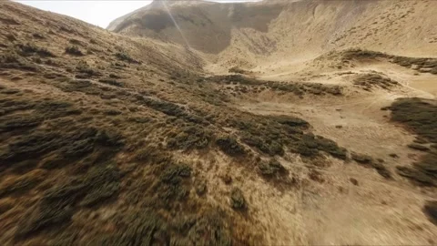 FPV Drone footage: Smooth Stabilized Fly along Mountain Rocky Hill around Stock Footage 162829470