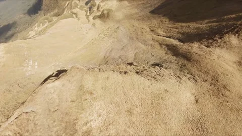FPV Drone footage: Smooth Stabilized Fly along Mountain Rocky Hill around Stock Footage 162829565