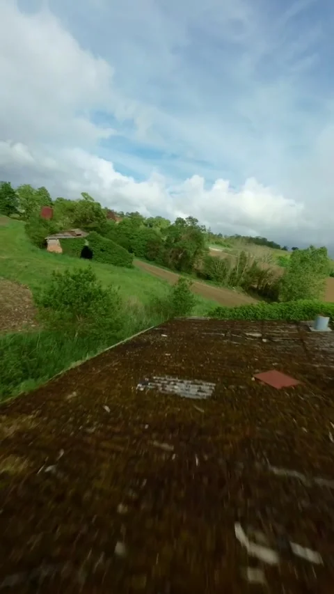 FPV drone glide above patchwork farmland in Brittany, France Stock Footage 327438848