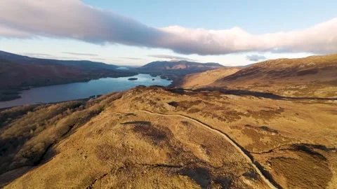 FPV drone gliding down mountain - Derwent Water, Keswick Stock Footage 325632448