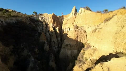 FPV Drone Gliding Over the Unique Rock Formations of Les Orgues d’Ille-sur-Têt! Stock Footage 302739723
