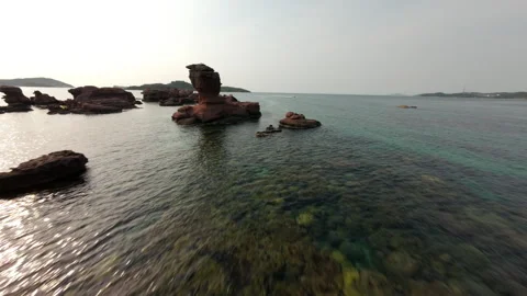 FPV Drone Low Flight over Coral Reef and Rocky Coastline in Phu Quoc Stock Footage 333101094