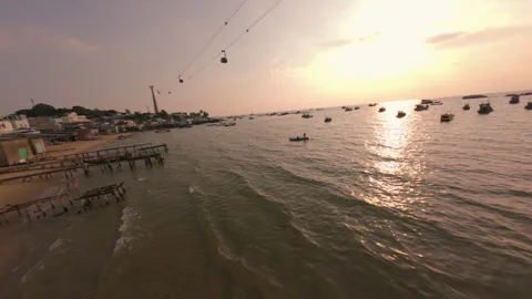 FPV Drone Low Flight Over Ocean and Fishing Boats at Golden Sunset in Phu Quoc Stock Footage 337011284