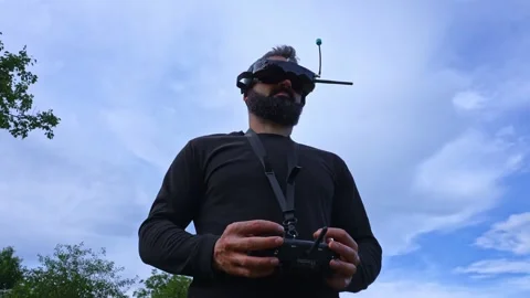 FPV drone man pilot operating copter waist up portrait outdoor 4K footage 스톡 동영상 280365286
