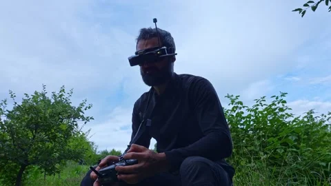 FPV drone man pilot take off VR glasses waist up 4K video outdoor 스톡 동영상 280365307