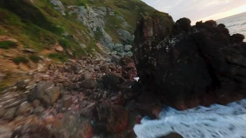 FPV Drone Navigating Rugged Irish Coastline with Crashing Waves Stock Footage 337454717