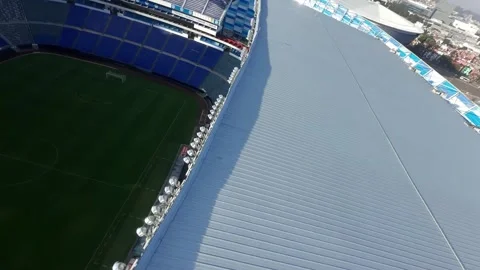 FPV Drone Orbit Flying Past Scoreboard Screen and Perimeter Ads Stock Footage 342545485
