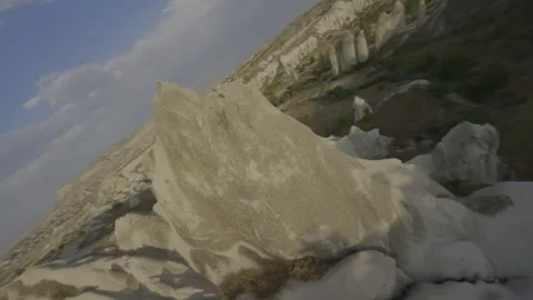 FPV Drone Orbit – LOG Flat Version – Mountain – Cappadocia – 4K Stock Footage 311072639