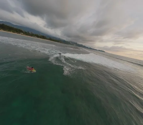 FPV drone over surfers at sunset, 4k 10bit flat color 8:7 aspect ratio Stock Footage 248126807
