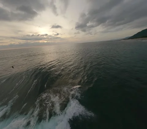 FPV drone over surfers at sunset, 4k 10bit flat color 8:7 aspect ratio Stock Footage 248129784