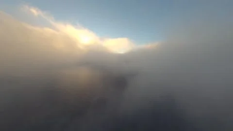FPV drone piercing through the clouds to unveil a sunset in Madeira, Portugal Stock Footage 253555768