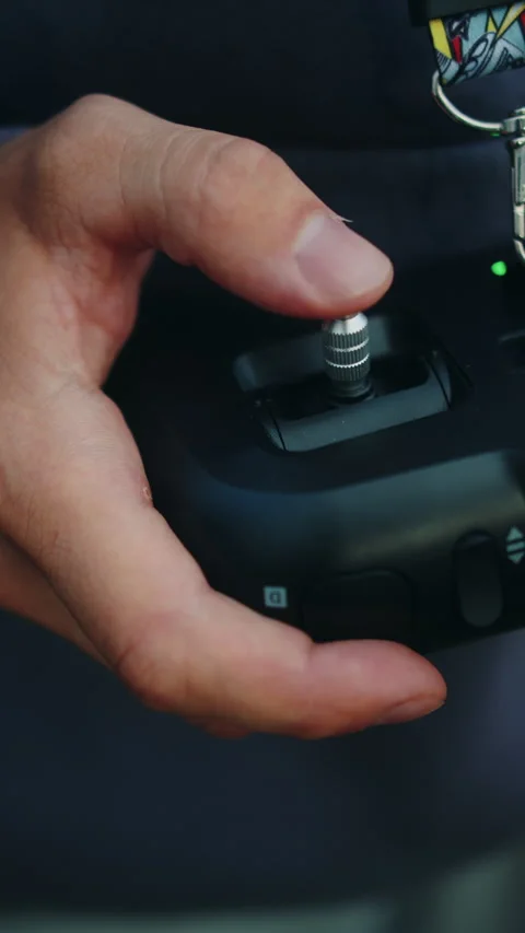 FPV drone pilot holding remote controller Video stock 308963298