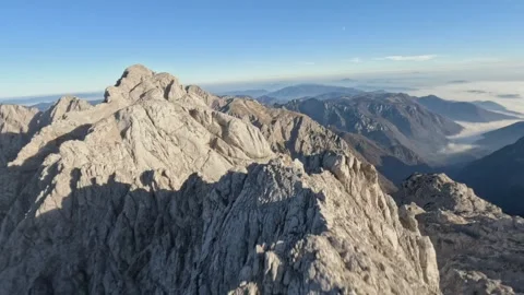 FPV Drone Proximity Flight Over Alpine Peaks, 4K Stock Footage 321204540