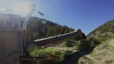 FPV Drone Pull-Away: Yankee Fork Gold Dredge – Conveyor Arm &amp; Tailings Reveal Stock Footage 332134550