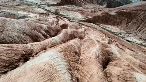 FPV drone pullback from Aktau Mountains in Altyn Emel National Park, Kazakhstan. Stock Footage 334612601