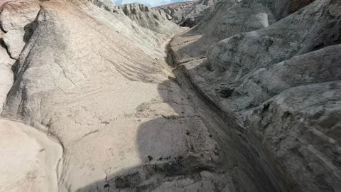 FPV drone pullback from Aktau Mountains in Altyn Emel National Park, Kazakhstan. Stock Footage 334727327