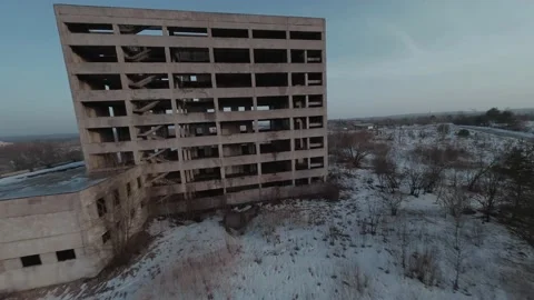 FPV drone quickly approaches and flies through an abandoned multi-storey Stock Footage 152510376