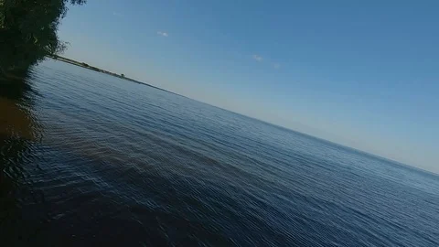 FPV Drone racing view. Dynamic flight over sea and coastline Video stock 116960474