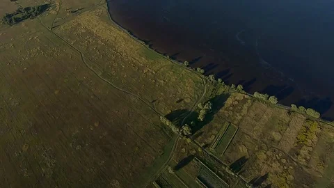 FPV Drone racing view. Fast free fall over coastline and field Vídeos de archivo 116961918