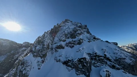 FPV Drone Reveals High Alpine Rifge Above Clouds, 4K Stock Footage 321152643