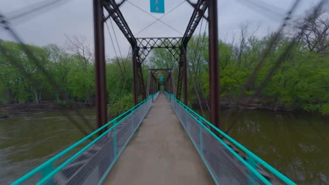 Fpv drone shot moving quickly forward on a path and crossing an old metal Vidéo 335899080