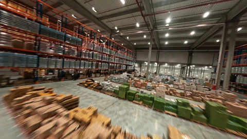FPV drone speed view of modern retail warehouse. Logistic center product Stock Footage 165416392
