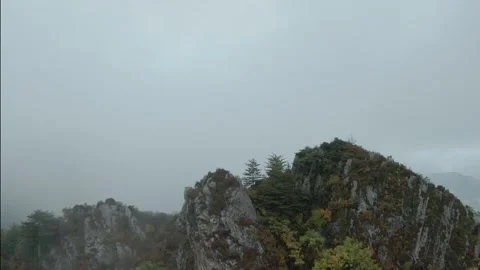 FPV drone swiftly flies into the mountain clouds.4K stock video Stock Footage 293324035