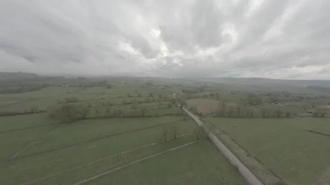 FPV drone swoops over road in the Peak District Stock Footage 271143338