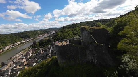 FPV drone video flying over small village DInant, Belgium, church stronghold Stock Footage 285073915