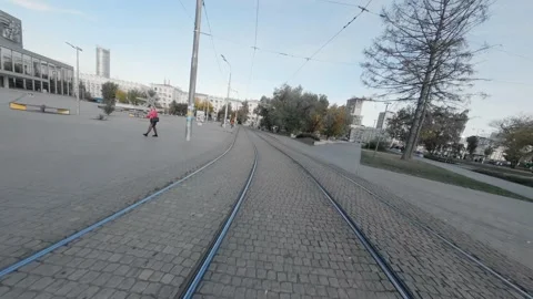 FPV drone view along Empty tram rails in city. Stock Footage 220000009