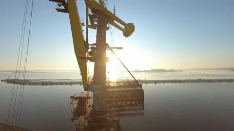 FPV drone view flight around port cranes in coal delivery terminal for thermal Stockbeeldmateriaal 169505008