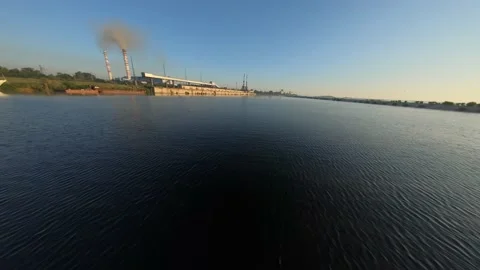 FPV drone view flight over water to empty coal delivery terminal with port Video stock 169504522