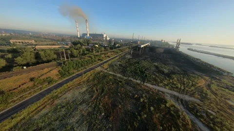 FPV drone view flight to thermal power plant with coal delivery terminal with Vidéo 169505706