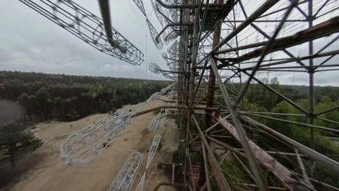 FPV drone view of over horizon duga radar system in the rain. The Chernobyl Stock Footage 155377466
