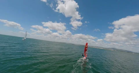 FPV Drone view of Wind Surfer at Ria Formosa Wetlands in Algarve, (C) Stock Footage 201273777