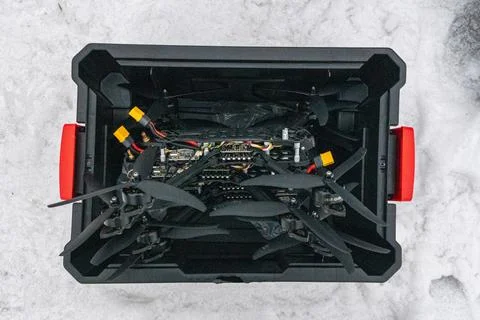 FPV drones packed inside a black utility crate in the snow Stock Photos
