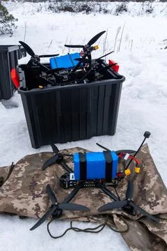 FPV drones stored in a box in snow Stock Photos