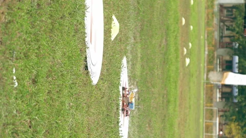 FPV drones taking off and flying away over grass Stock Footage 91143747