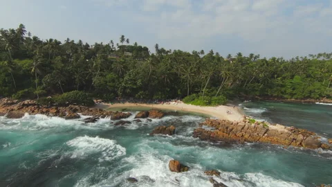 FPV (First Person View) Flying Towards Rocky , People Relaxing On Stunning Stock Footage 186191234